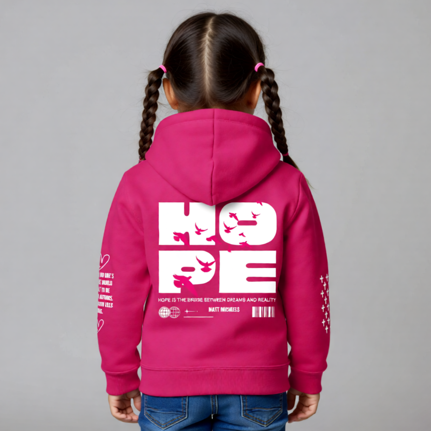 Child wearing a pink hoodie with 'HOPE' text on the back against a gray background