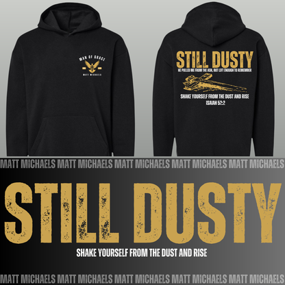Black hoodie with 'Still Dusty' text and design on a gray background